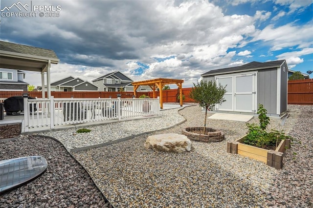 view of yard featuring a pergola, a patio, and a storage unit