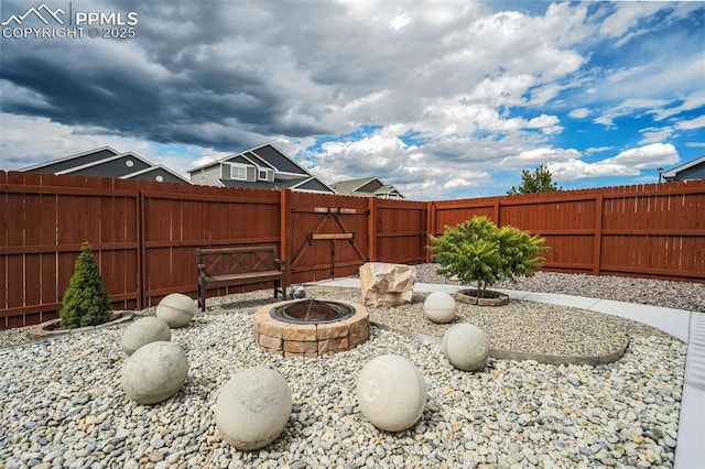 view of yard with an outdoor fire pit