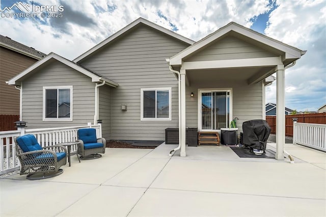 rear view of property featuring a patio