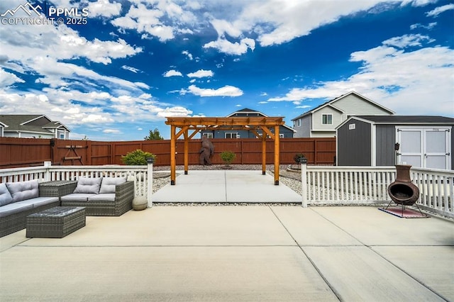 view of patio / terrace featuring a storage shed, an outdoor living space, and a gazebo