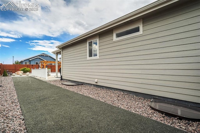 view of side of property featuring a patio