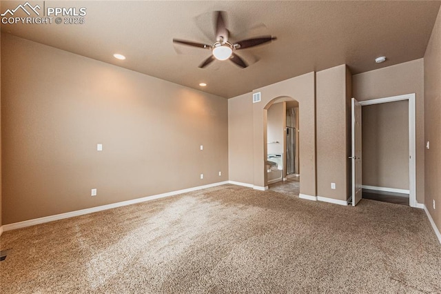 unfurnished bedroom with ceiling fan and carpet