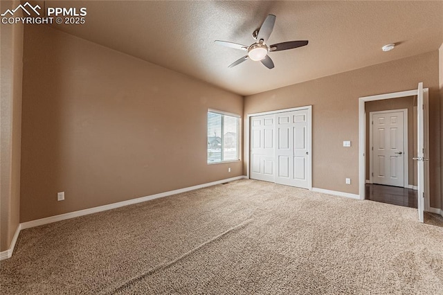 unfurnished bedroom featuring ceiling fan, a closet, carpet, and a textured ceiling