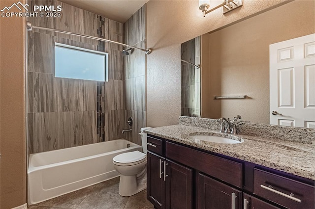 full bathroom with tile patterned flooring, tiled shower / bath, vanity, and toilet