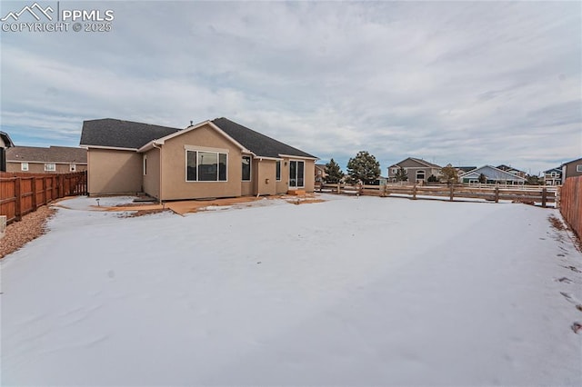 view of snow covered house