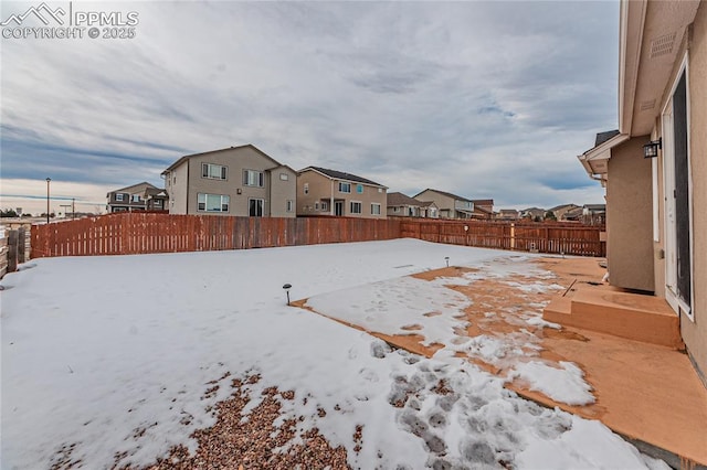 view of yard covered in snow