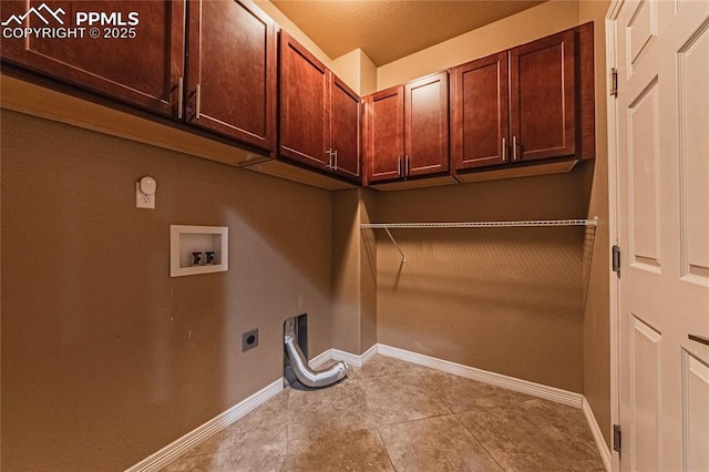 washroom featuring cabinets, washer hookup, and electric dryer hookup