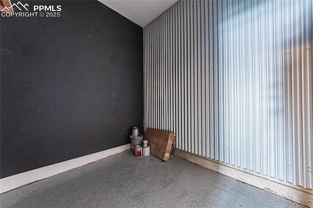 empty room featuring vaulted ceiling