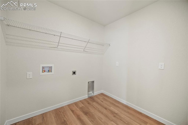 laundry area featuring hardwood / wood-style flooring, hookup for an electric dryer, and hookup for a washing machine