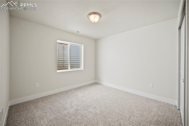 spare room with carpet flooring