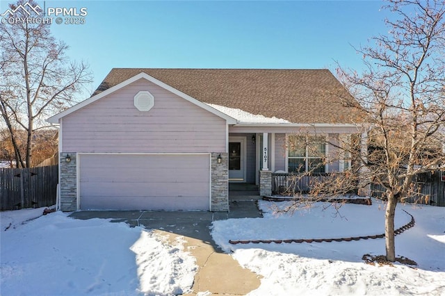 view of front of house featuring a porch and a garage