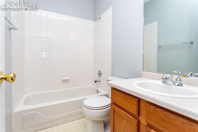 full bathroom with tiled shower / bath, vanity, and toilet