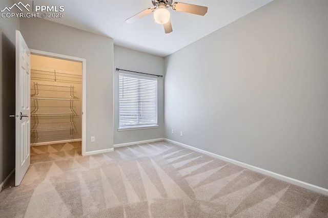 unfurnished bedroom featuring ceiling fan and light colored carpet