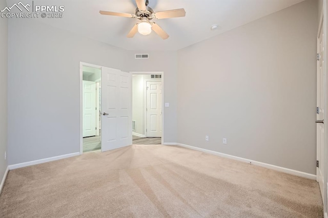 unfurnished bedroom with ceiling fan and light carpet