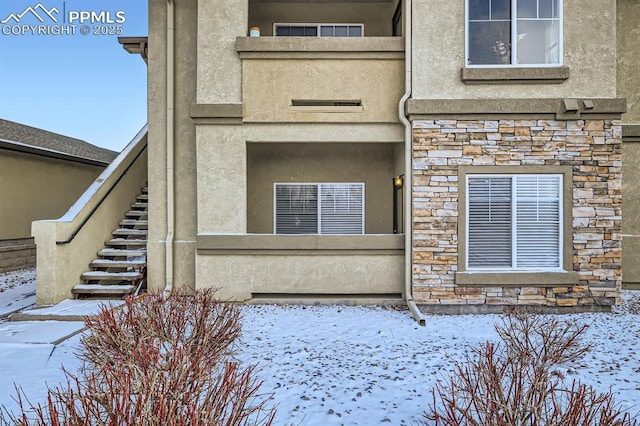 view of snow covered property entrance