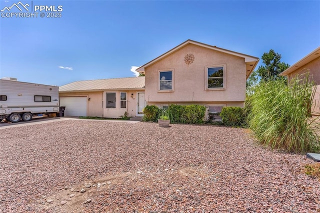 split level home featuring a garage