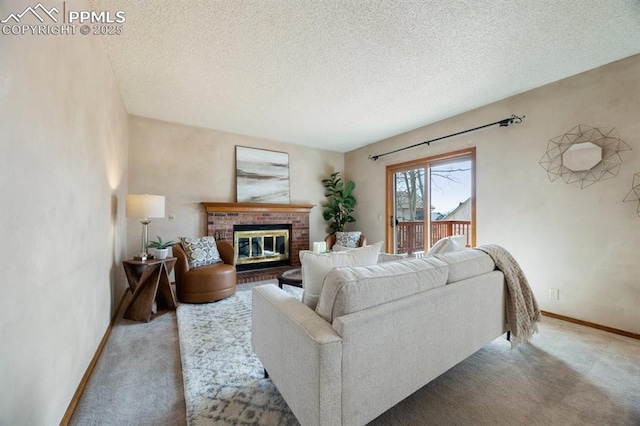 carpeted living room with a textured ceiling, a fireplace, and baseboards