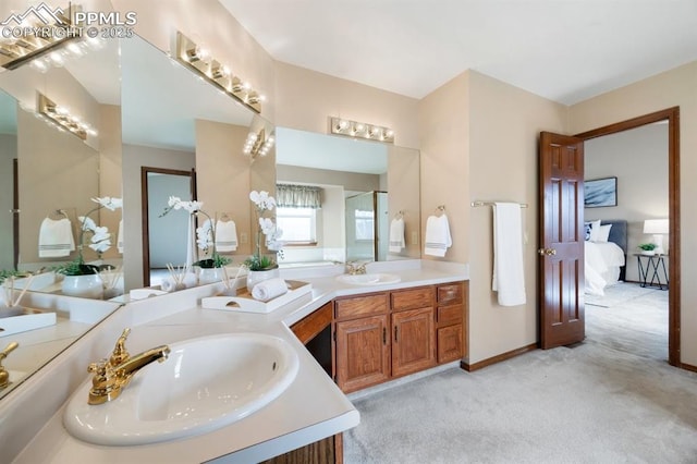 bathroom with vanity and baseboards