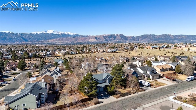 bird's eye view featuring a mountain view and a residential view