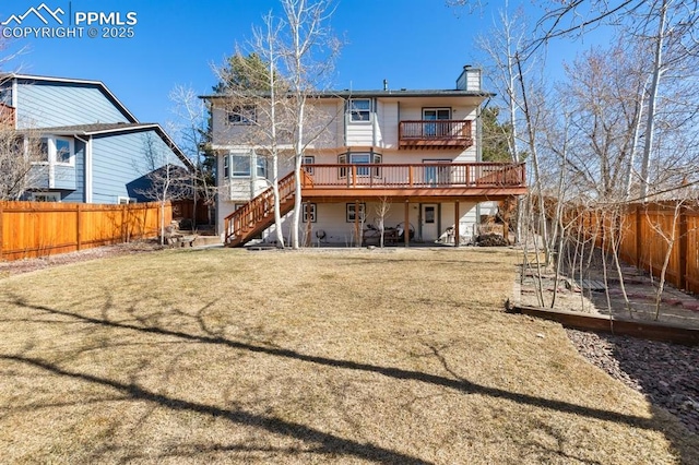 rear view of house with a fenced backyard, a vegetable garden, a chimney, and stairs