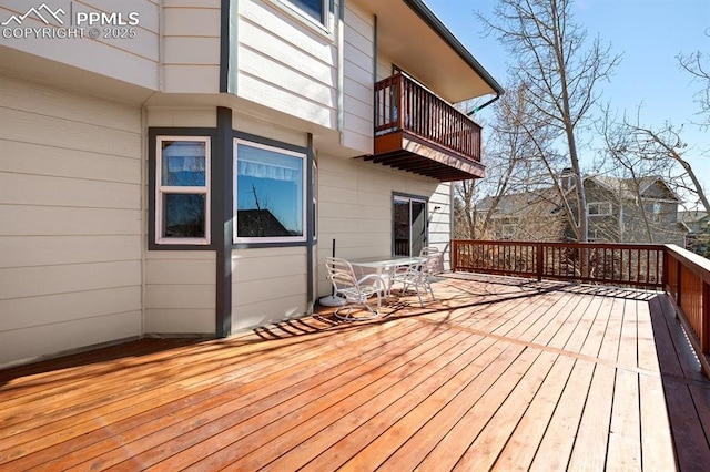 wooden deck featuring outdoor dining space