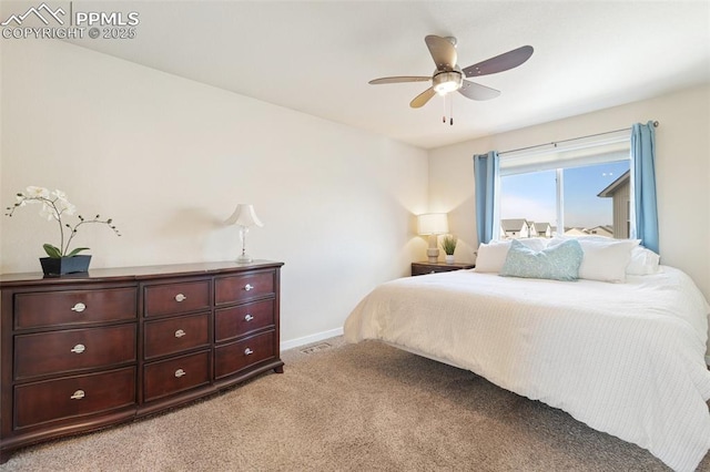 bedroom with baseboards, ceiling fan, and light colored carpet