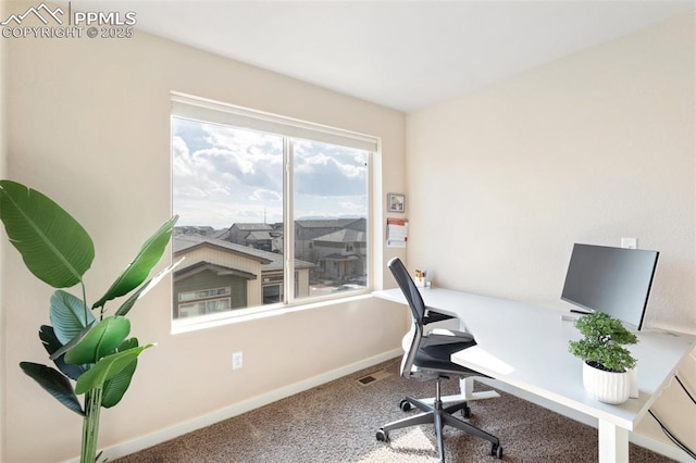 home office with carpet floors, visible vents, and baseboards