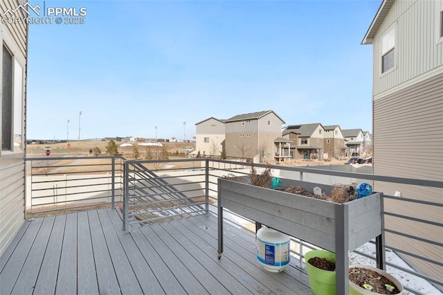 wooden deck with a residential view