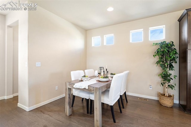 dining space with dark wood-style flooring, recessed lighting, visible vents, and baseboards