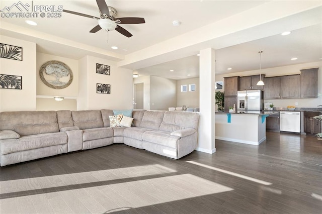 living area with dark wood-style floors, recessed lighting, baseboards, and a ceiling fan