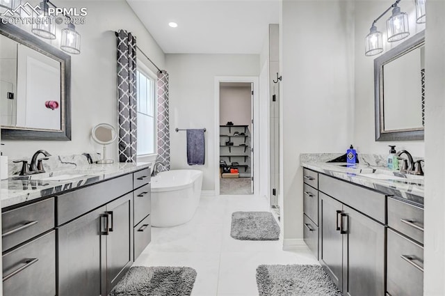 bathroom with vanity and a tub to relax in