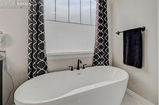 bathroom featuring a tub to relax in