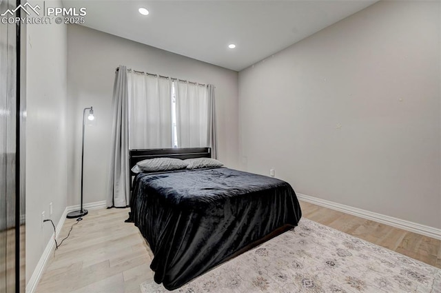 bedroom with light hardwood / wood-style flooring