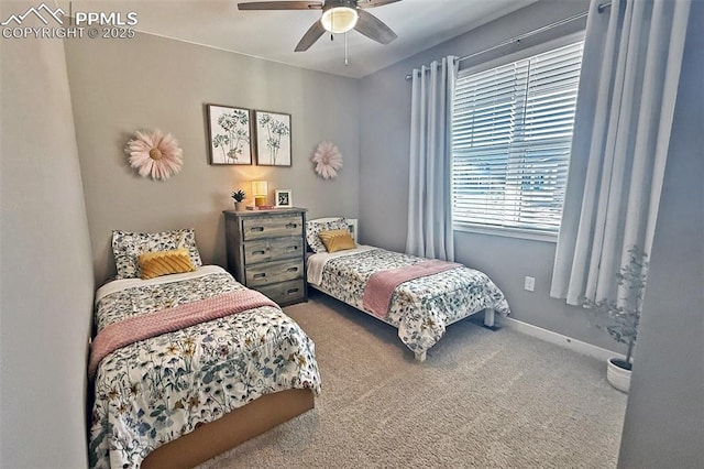 carpeted bedroom with baseboards and a ceiling fan