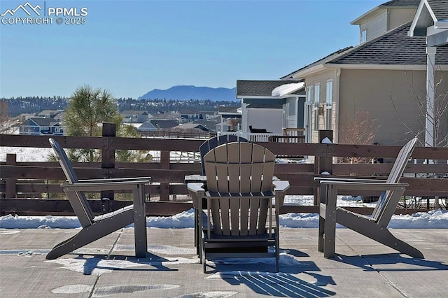 view of patio / terrace featuring a residential view and a mountain view