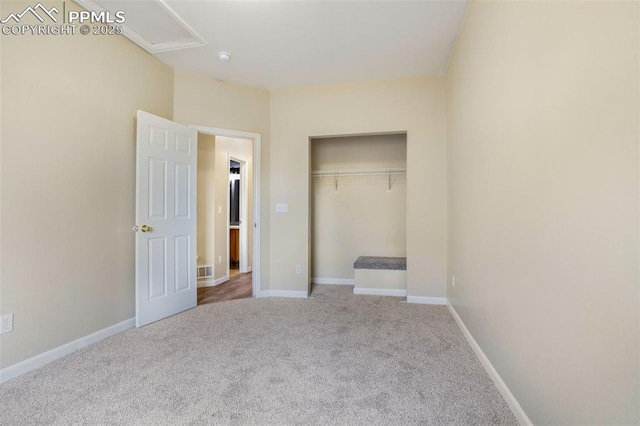 unfurnished bedroom with a closet and carpet