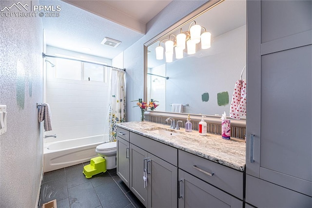 full bathroom with tile patterned floors, toilet, a textured ceiling, vanity, and shower / bath combo with shower curtain