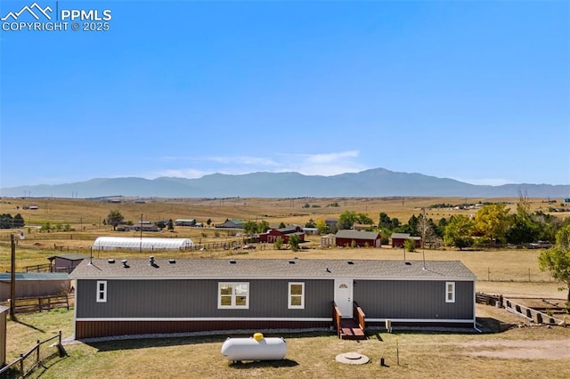 exterior space featuring a rural view and a mountain view