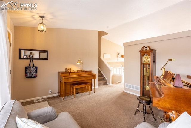 carpeted living room with lofted ceiling