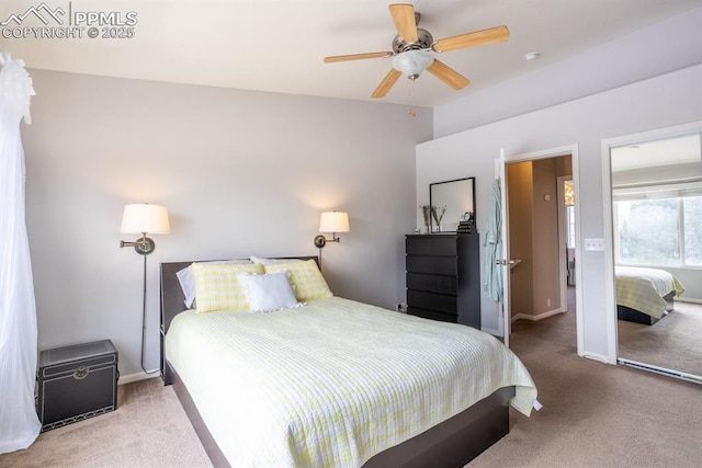 bedroom with ceiling fan, lofted ceiling, and carpet flooring