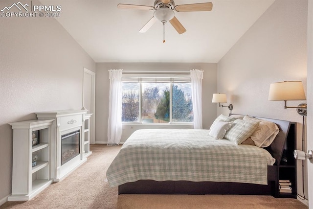 bedroom featuring lofted ceiling, light colored carpet, and ceiling fan