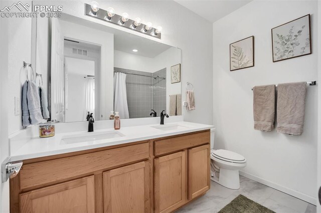 2315 Sunrise Ln, Pueblo, CO 81008 - bathroom with vanity, toilet, and walk in shower