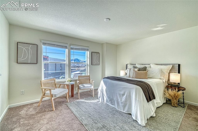 carpeted bedroom featuring a textured ceiling