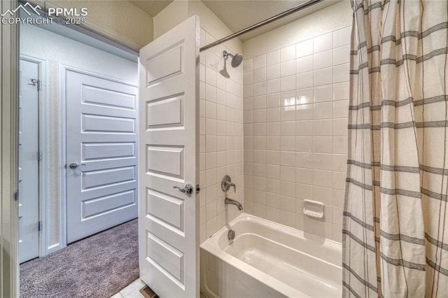 bathroom with shower / bath combo