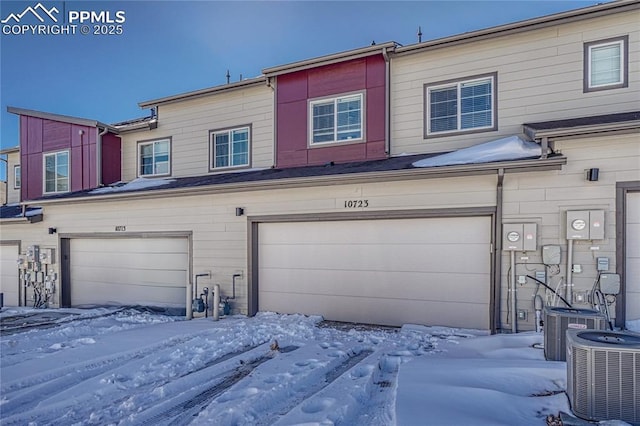 exterior space featuring central AC and a garage