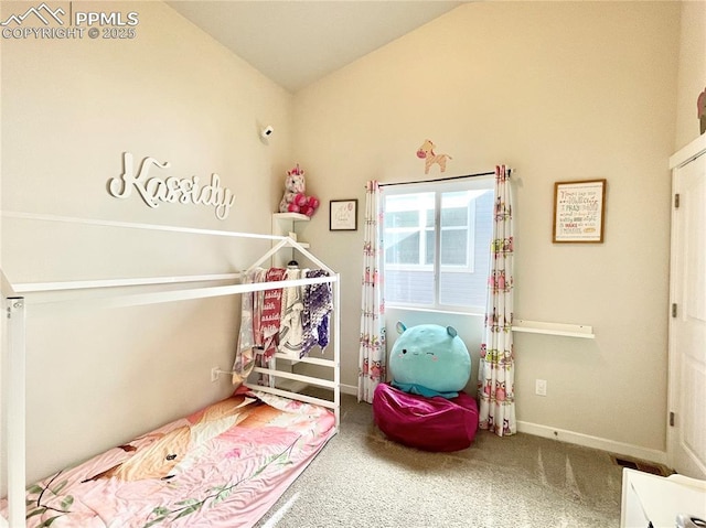 carpeted bedroom with vaulted ceiling