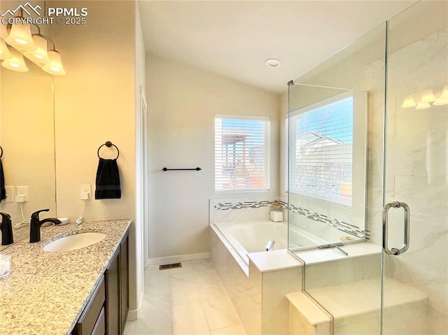 bathroom with lofted ceiling, vanity, and shower with separate bathtub