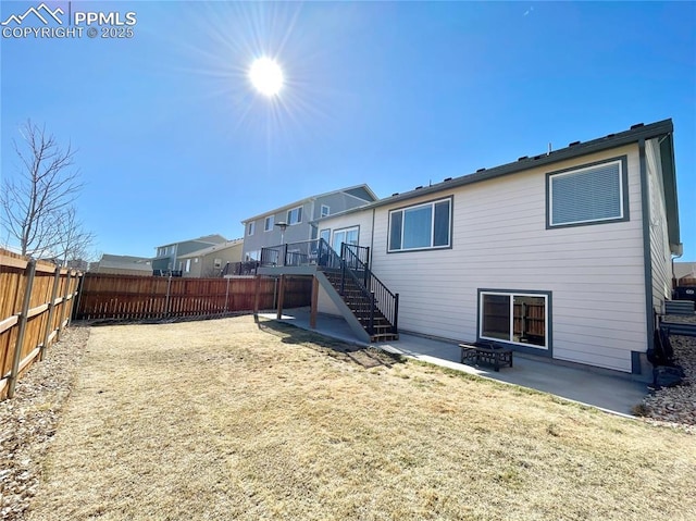 back of property with a patio