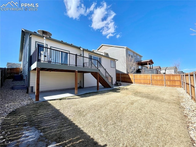 back of house with a patio and a wooden deck