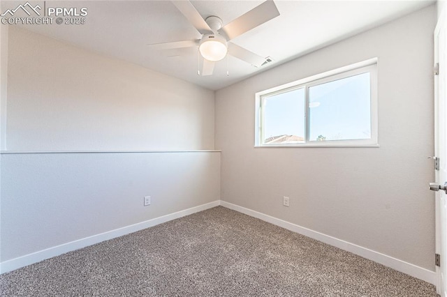 carpeted spare room featuring ceiling fan